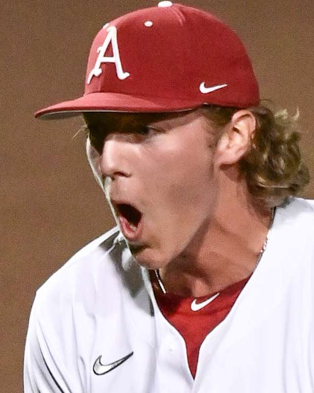 Razorbacks' Hagen Smith celebrates closing out 5-2 win over Tennessee to start series.